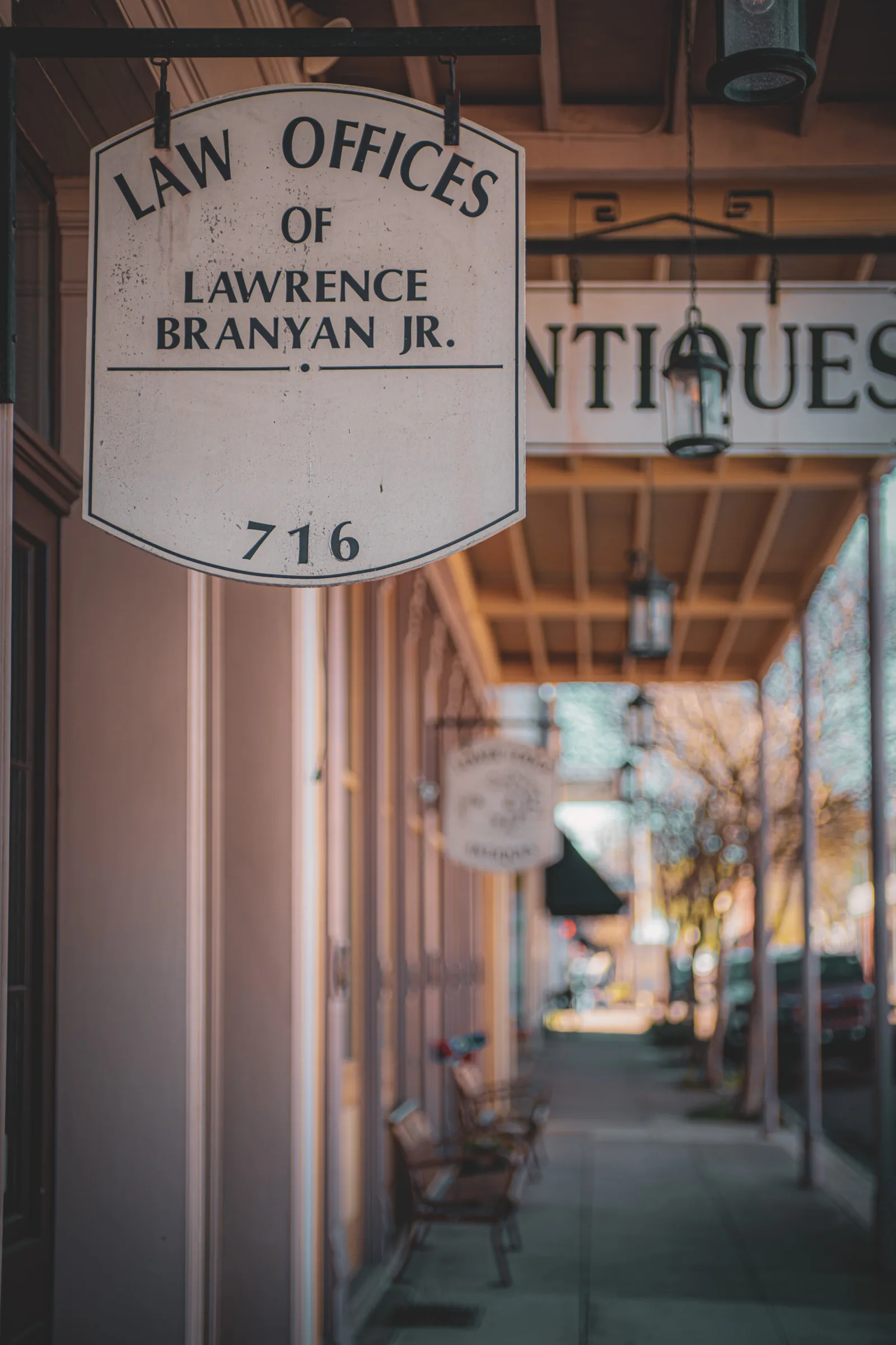 Brick sidewalk with awnings on Natchez main street